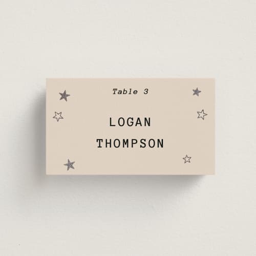 This is a ecru wedding place cards with foil pressed by Jennifer Lew called supernova printing on signature in placecard