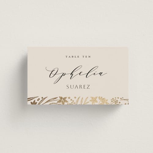 This is a champagne wedding place cards with foil pressed by Leah Bisch called floral border printing on signature in placecard