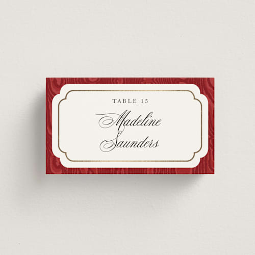 This is a crimson wedding place cards with foil pressed by Studio Suku called moiré printing on signature in placecard