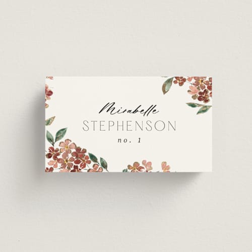 This is a dusty rose wedding place cards with foil pressed by Itsy Belle Studio called sweeping vine printing on signature in placecard