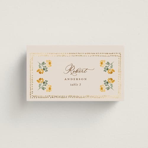 This is a golden wedding place cards with foil pressed by Claudia Orengo called tuileries printing on signature in placecard