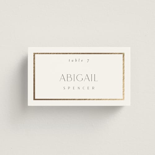 This is a porcelain wedding place cards with foil pressed by Nicole Walsh called regal printing on signature in placecard