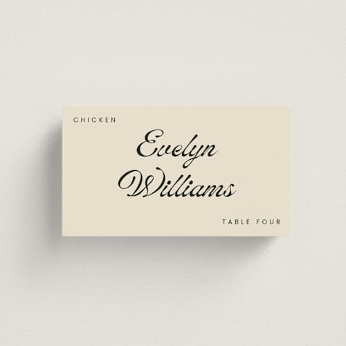 This is a cream wedding place cards with standard by Stacy Maalouf called vintage printing on signature in placecard