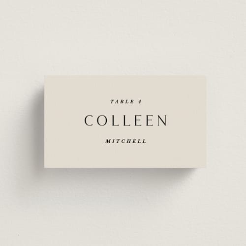 This is a almond wedding place cards with standard by Olivia Kanaley Inman called blockprint printing on signature in placecard