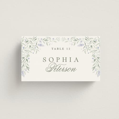 This is a periwinkle wedding place cards with standard by Kristen Smith called delicate vines printing on signature in placecard