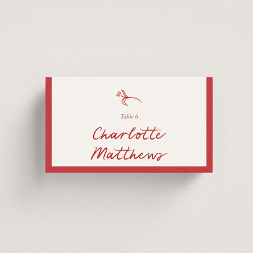 This is a brick wedding place cards with standard by Julia Liverton called love in bloom printing on signature in placecard