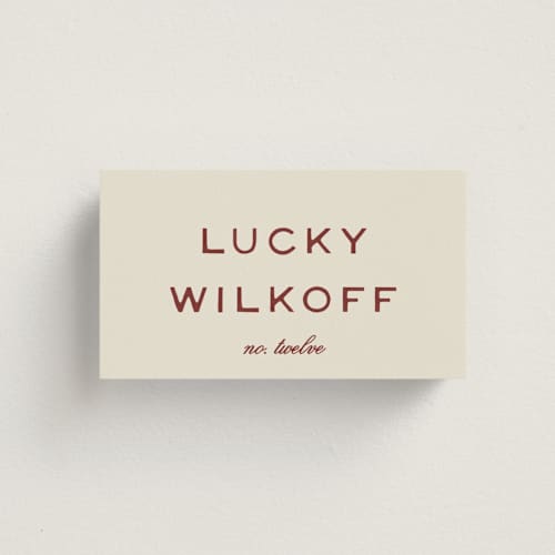 This is a rust wedding place cards with standard by Ani Somi called rose ink printing on signature in placecard