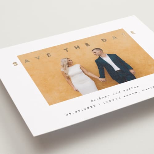 This is a porcelain foil stamped save the date cards with foil pressed by Stacy Maalouf called gilded simplicity printing on recycled smooth signature in standard