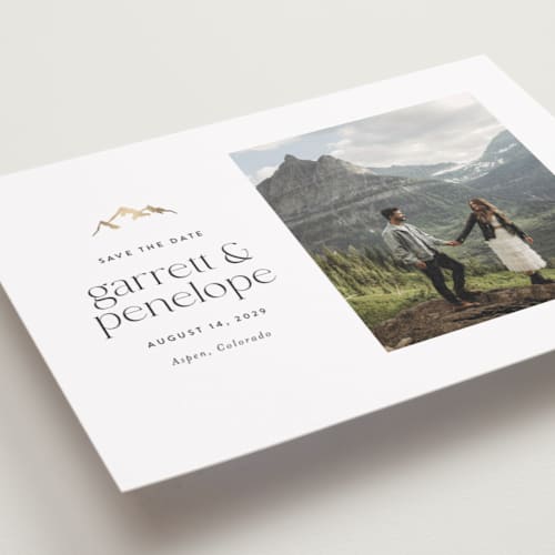 This is a snow foil stamped save the date cards with foil pressed by Amy Payne called minimal mountain printing on recycled smooth signature in standard