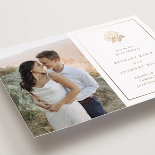 This is a cotton foil stamped save the date cards with foil pressed by Stacey Meacham called hydrangea bloom printing on recycled smooth signature in standard