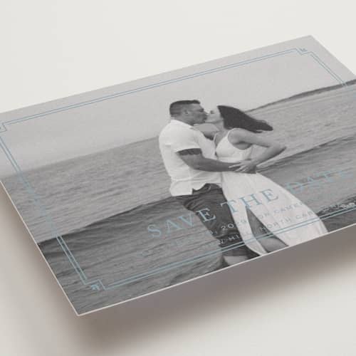 This is a french blue save the date with standard by Carolyn MacLaren called fleur corner printing on recycled smooth signature in standard