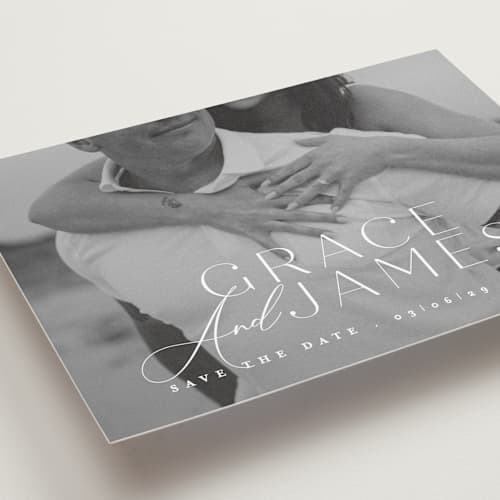 This is a snow save the date with standard by Angela Thompson called namesake printing on recycled smooth signature in standard