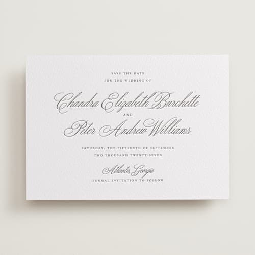 This is a graphite save the date with letterpress by Wildfield Paper Co called calligraphie printing on white cotton in standard