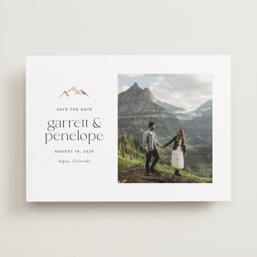 This is a snow foil stamped save the date cards with foil pressed by Amy Payne called minimal mountain printing on recycled smooth signature in standard