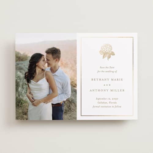 This is a cotton foil stamped save the date cards with foil pressed by Stacey Meacham called hydrangea bloom printing on recycled smooth signature in standard