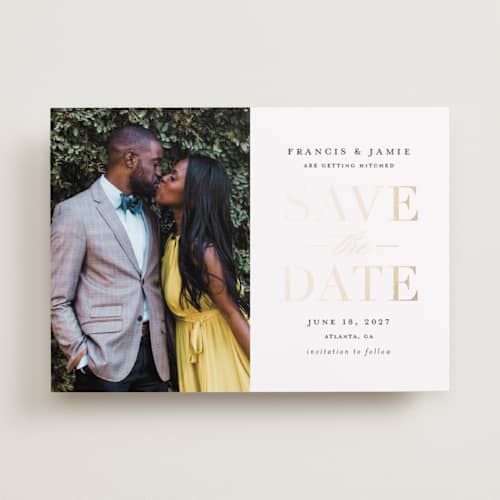 This is a gold giltz foil stamped save the date cards with foil pressed by Stacey Meacham called simply striking printing on recycled smooth signature in standard