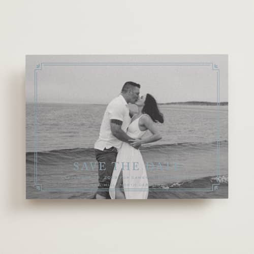 This is a french blue save the date with standard by Carolyn MacLaren called fleur corner printing on recycled smooth signature in standard