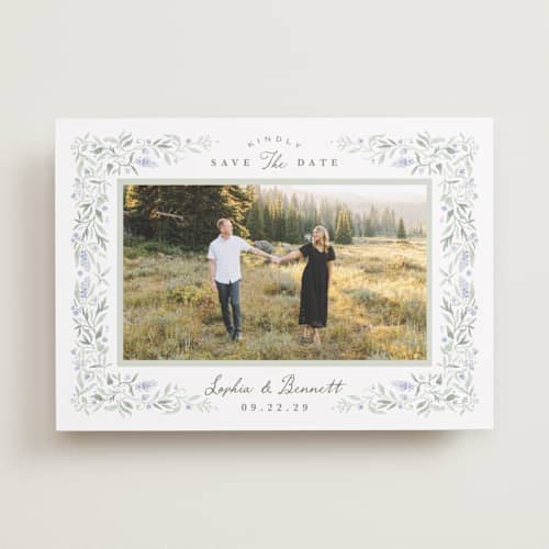 This is a periwinkle save the date with standard by Kristen Smith called delicate vines printing on recycled smooth signature in standard