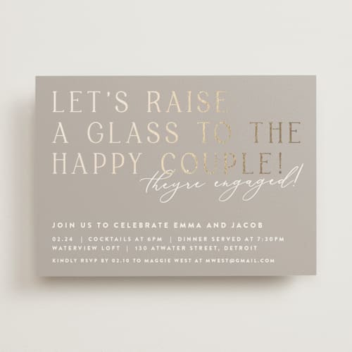 This is a buttercream engagement party invitations with foil pressed by Lisa Assenmacher called let's raise a glass printing on signature in standard