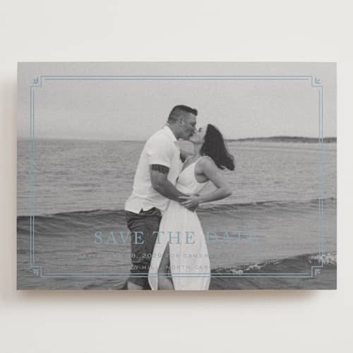 This is a french blue save the date with standard by Carolyn MacLaren called fleur corner printing on recycled smooth signature in grand