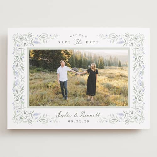 This is a periwinkle save the date with standard by Kristen Smith called delicate vines printing on recycled smooth signature in grand