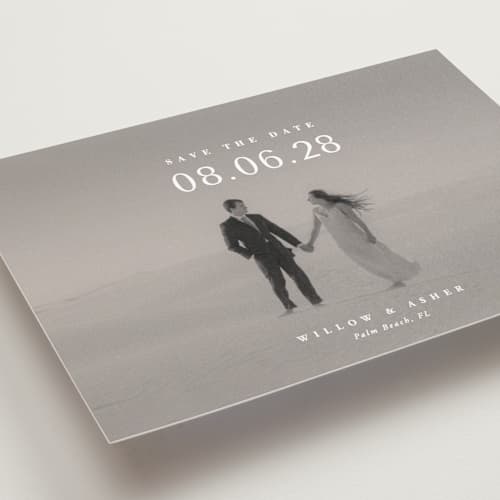 This is a moonstone petite save the dates with standard by Lucrecia Caporale called classic big date printing on recycled smooth signature in petite