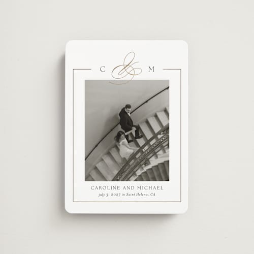 This is a silk save the date magnets with foil pressed by Kelly Schmidt called framed monogram printing on magnet paper in magnet