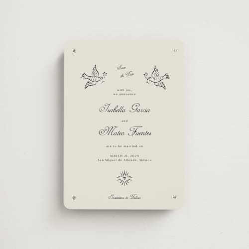 This is a ivory save the date magnets with standard by Ani Somi called milagro printing on magnet paper in magnet