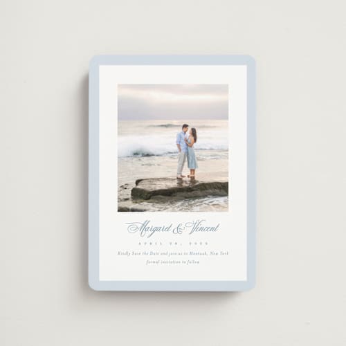 This is a dusty blue save the date magnets with standard by Jennifer Postorino called coastal charm printing on magnet paper in magnet