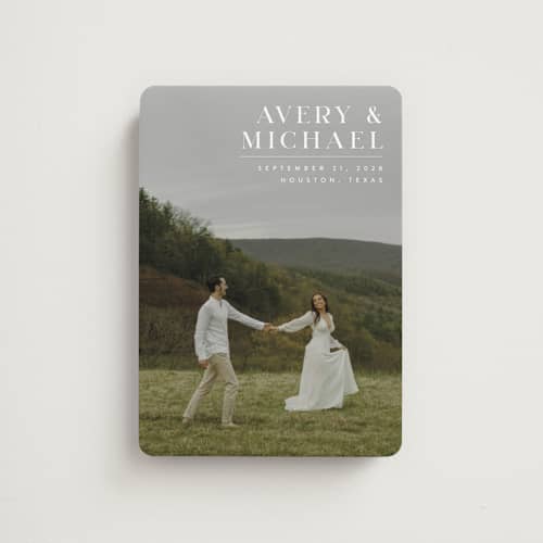 This is a ivory save the date magnets with standard by Juneau Designs called hold tight printing on magnet paper in magnet