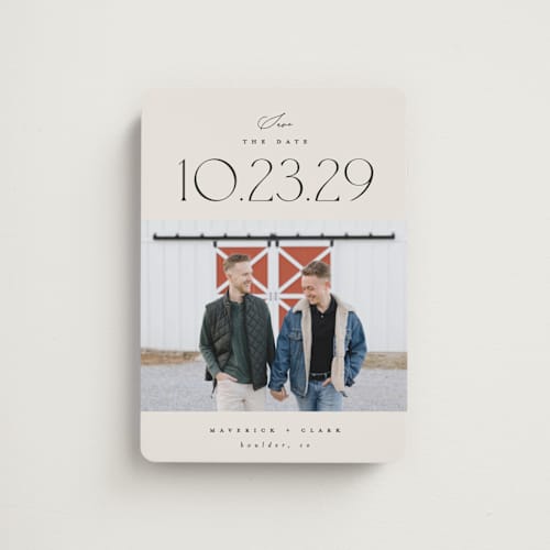 This is a ivory save the date magnets with standard by Carolyn Nicks called romancing the date printing on magnet paper in magnet