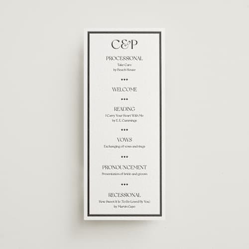 This is a soft black | graphite unique wedding programs with letterpress by Julia Liverton called trés chic printing on white cotton in 4x9