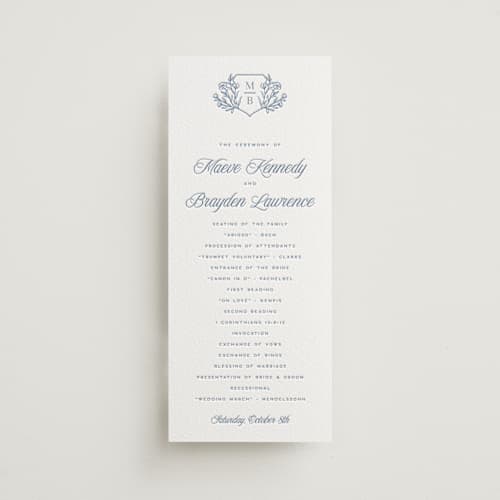 This is a pacific blue unique wedding programs with letterpress by Hooray Creative called blue crest printing on white cotton in 4x9