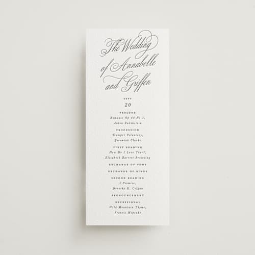 This is a soft black unique wedding programs with letterpress by Susan Zinader called romantic script printing on white cotton in 4x9