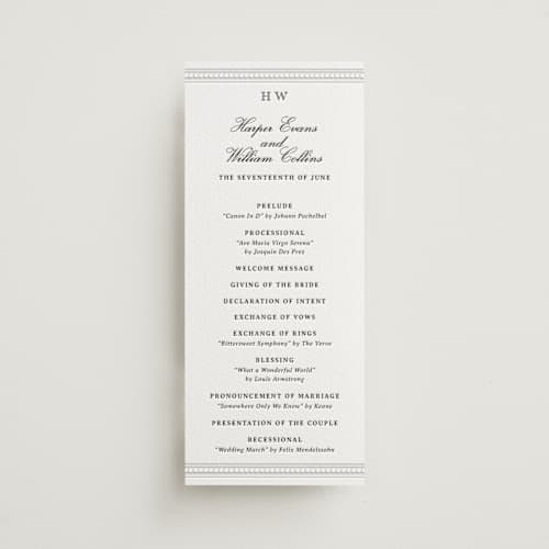 This is a soft black unique wedding programs with letterpress by Jenna Holcomb called the ritz printing on white cotton in 4x9