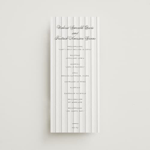 This is a soft black unique wedding programs with letterpress by Baumbirdy called striped printing on white cotton in 4x9