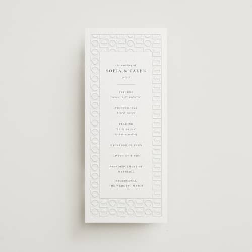 This is a slate unique wedding programs with letterpress by Vera Lim called cerchi printing on white cotton in 4x9