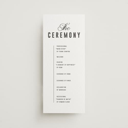 This is a soft black unique wedding programs with letterpress by Sumak Studio called bold & elegant printing on white cotton in 4x9