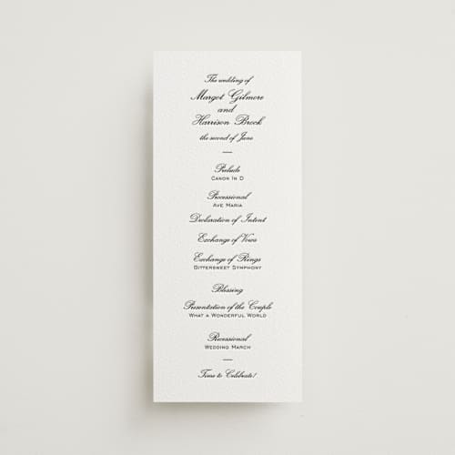 This is a soft black unique wedding programs with letterpress by Megan Davis called cornelia printing on white cotton in 4x9