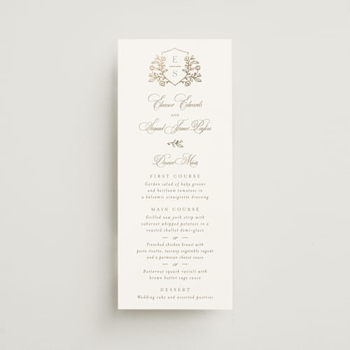 This is a ivory menu cards with foil pressed by Mansi Verma called gold crest printing on signature in 4x9