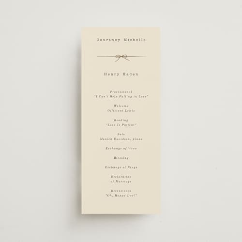 This is a ivory unique wedding programs with foil pressed by Baumbirdy called bow tie printing on signature in 4x9