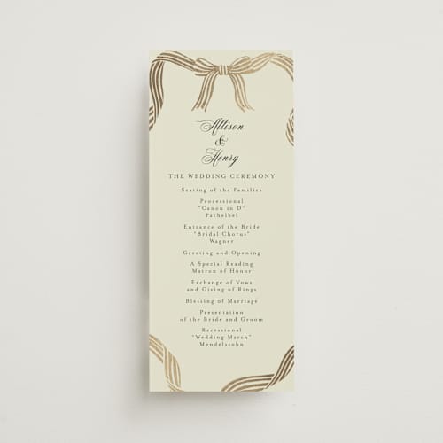 This is a champagne unique wedding programs with foil pressed by Chris Griffith called all tied up printing on signature in 4x9