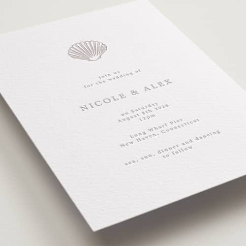 This is a dove grey letterpress wedding invitations with letterpress by Hannah Bowman called simple seashell printing on white cotton in standard