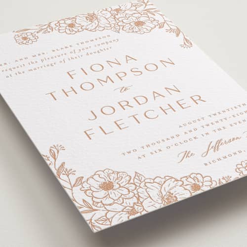 This is a sandstone letterpress wedding invitations with letterpress by Vera Lim called camellia.. printing on white cotton in standard