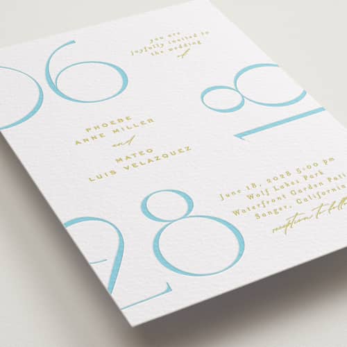 This is a robin's egg letterpress wedding invitations with letterpress by Owl and Toad called numerical printing on white cotton in standard