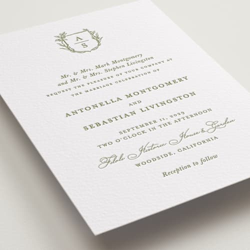 This is a olive letterpress wedding invitations with letterpress by Lucrecia Caporale called botanical crest printing on white cotton in standard