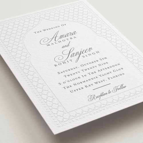 This is a soft black letterpress wedding invitations with letterpress by Oma N. Ramkhelawan called kamal printing on white cotton in standard