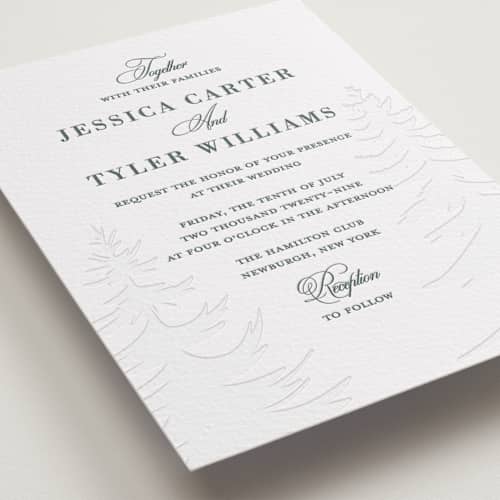 This is a slate letterpress wedding invitations with letterpress by Teju Reval called evergreen printing on white cotton in standard