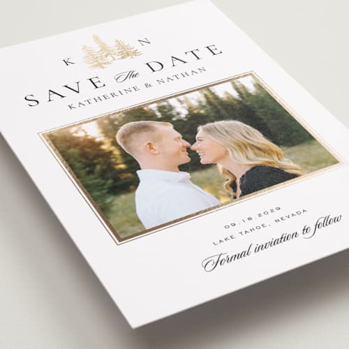 This is a snow foil stamped save the date cards with foil pressed by Stacy Maalouf called gilded forest printing on recycled smooth signature in standard