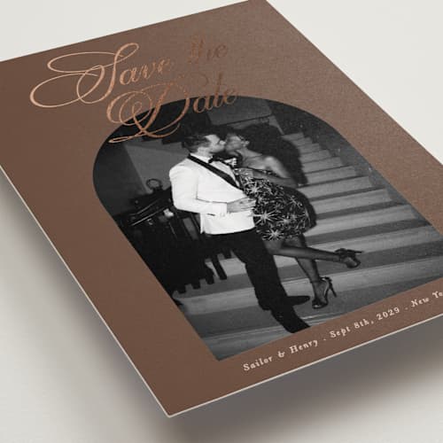 This is a nutmeg foil stamped save the date cards with foil pressed by Morgan Kendall called playbill printing on recycled smooth signature in standard